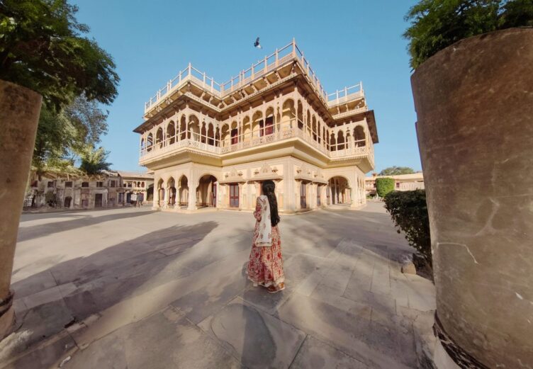 Girl staring at City palace of jaipur