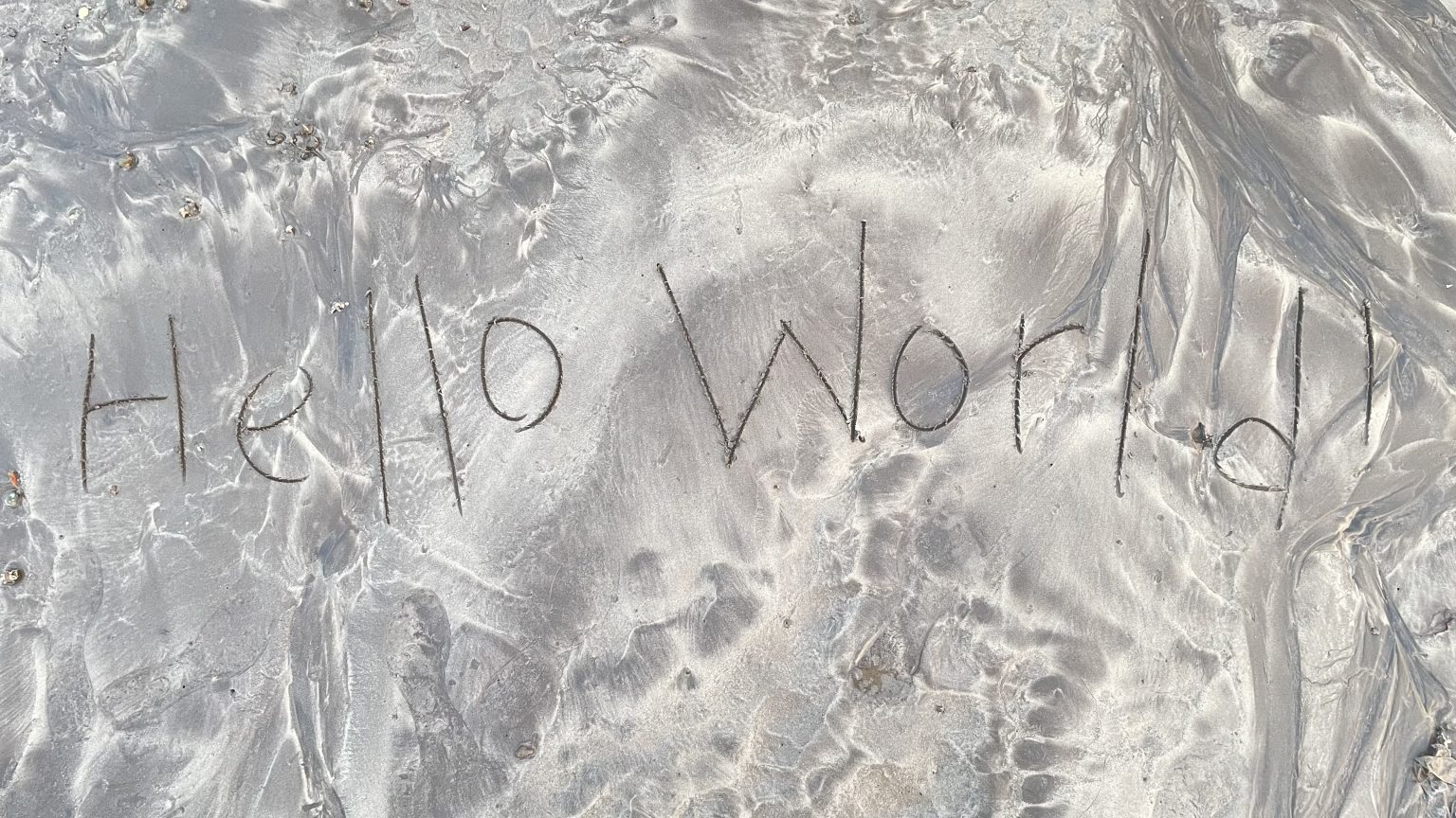 "Hello World" etched in the sand on Alibag beach, Mumbai.
